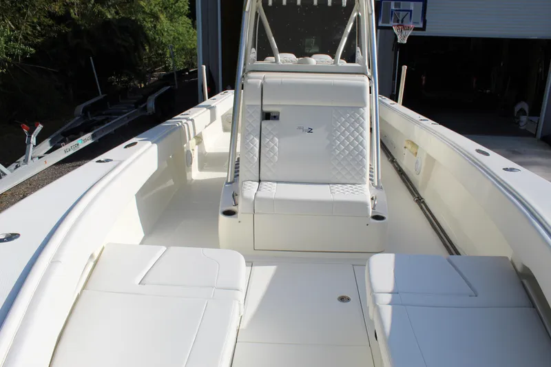 Slide: The Image of 2016 SeaVee 340Z boat interior with white seating and console. - 27