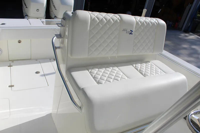 Slide: The Image of 2016 SeaVee 340Z boat with white quilted seating and sleek design. - 28