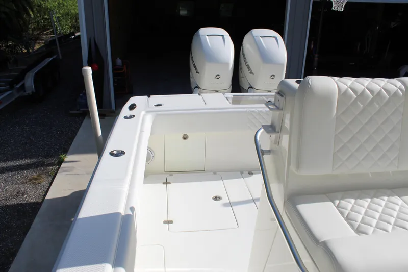 Slide: The Image of 2016 SeaVee 340Z boat with dual outboard engines and white quilted seating. - 29