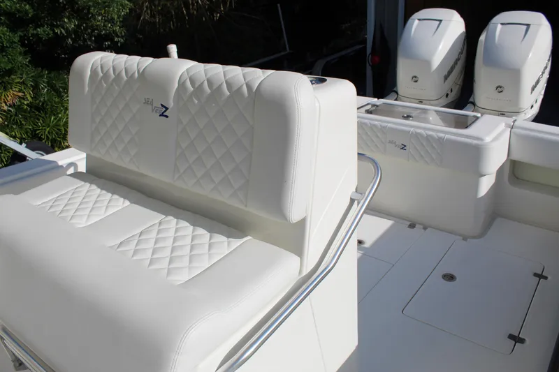 Slide: The Image of 2016 SeaVee 340Z boat with white quilted seating and dual outboard engines. - 31
