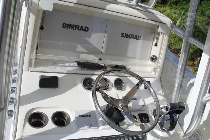 Slide: The Image of 2016 SeaVee 340Z boat dashboard with Simrad electronics and steering wheel. - 33