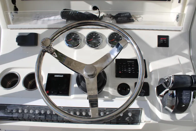 Slide: The Image of 2016 SeaVee 340Z boat dashboard with steering wheel and control panel. - 34