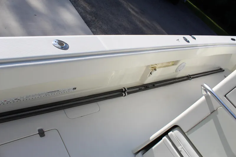 Slide: The Image of 2016 SeaVee 340Z boat deck with rod holders and storage compartments. - 36