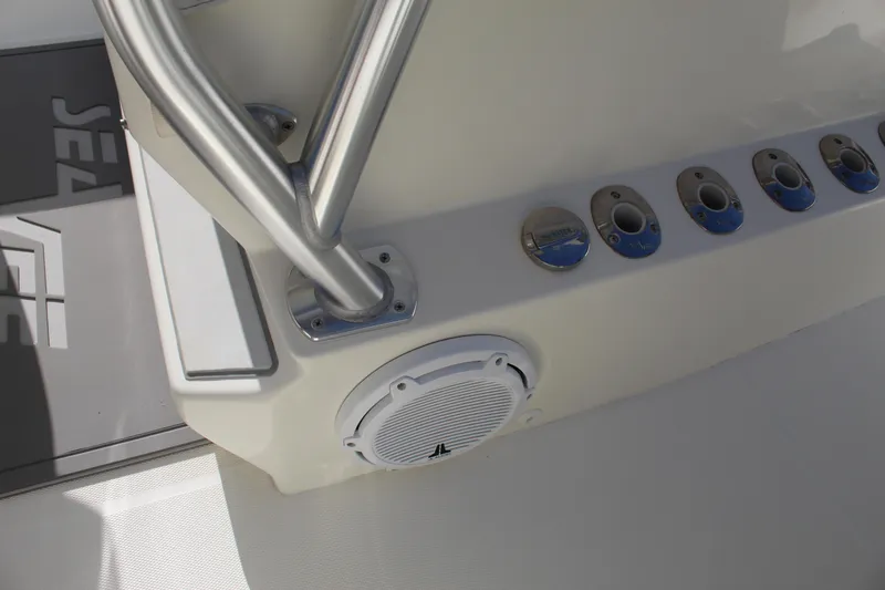 Slide: The Image of 2016 SeaVee 340Z boat console with speaker and rod holders. - 38
