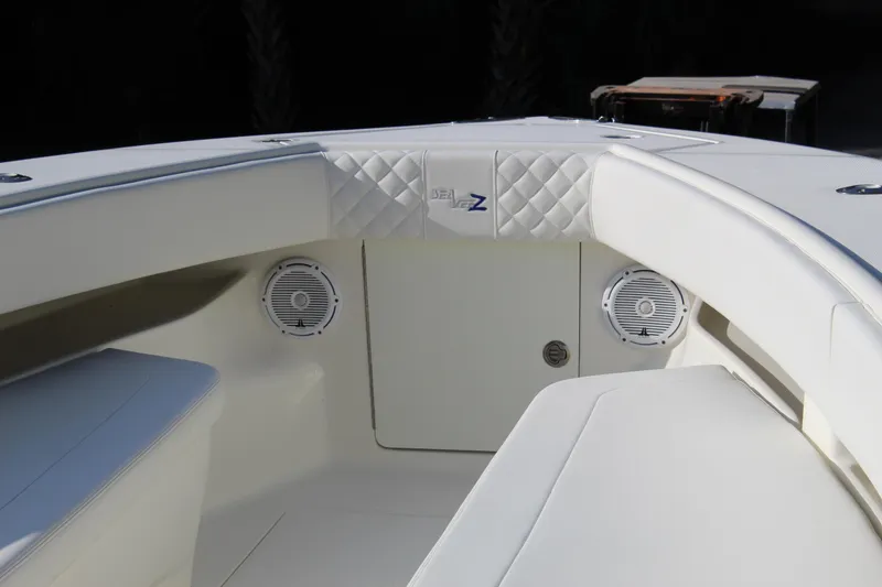 Slide: The Image of 2016 SeaVee 340Z boat interior with cushioned seating and built-in speakers. - 39