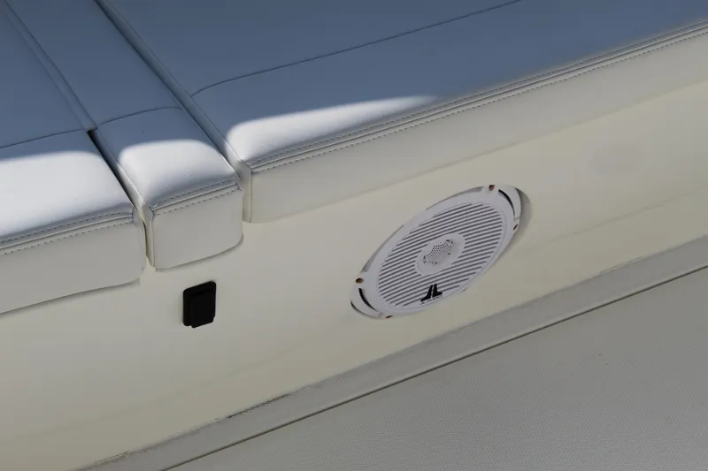 Slide: The Image of 2016 SeaVee 340Z boat with white cushioned seating and built-in speaker. - 40