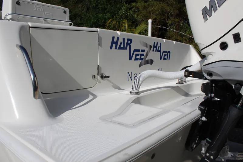 Slide: The Image of 2016 SeaVee 340Z boat deck with motor and storage compartment. - 5