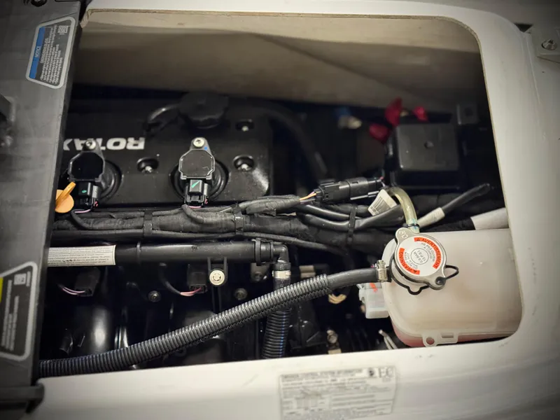 Slide: The Image of Engine compartment of 2023 Sea-Doo Fishpro Sport 170, showcasing internal components and wiring. - 15