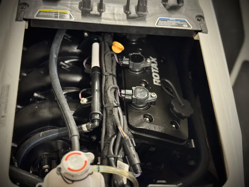 Slide: The Image of Engine compartment of 2023 Sea-Doo Fishpro Sport 170, featuring Rotax components. - 16