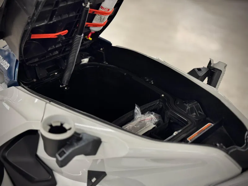 Slide: The Image of 2023 Sea-Doo Fishpro Sport 170 storage compartment open, showcasing interior features. - 8