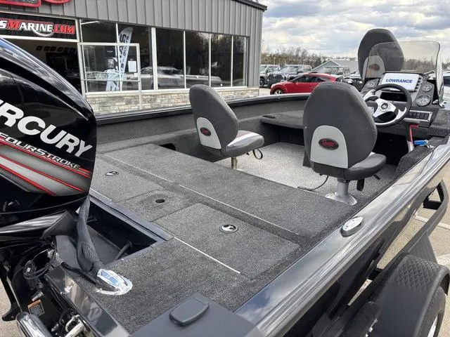 Slide: The Image of 2016 Ranger VS1680 boat with Mercury engine, featuring spacious seating and modern dashboard. - 3