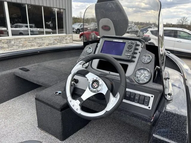 Slide: The Image of 2016 Ranger VS1680 boat dashboard with steering wheel and navigation system. - 4