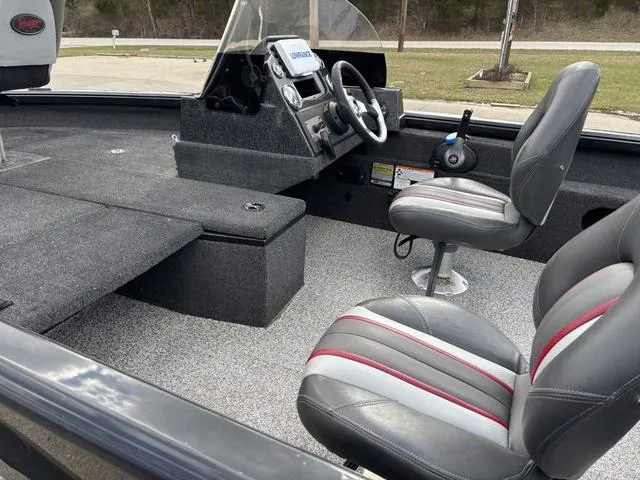 Slide: The Image of 2016 Ranger VS1680 boat interior with steering console and seating. - 7