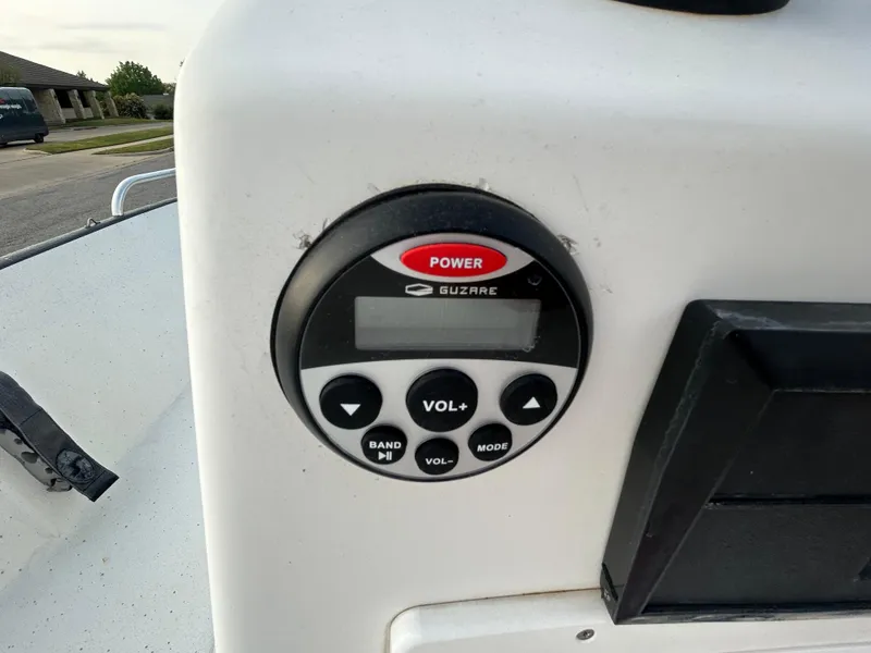 Slide: The Image of Control panel on a 2006 Carolina Skiff SEA CHASER boat, featuring power and volume buttons. - 22