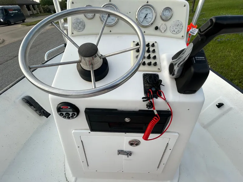 Slide: The Image of 2006 Carolina Skiff SEA CHASER boat console with steering wheel and control panel. - 23