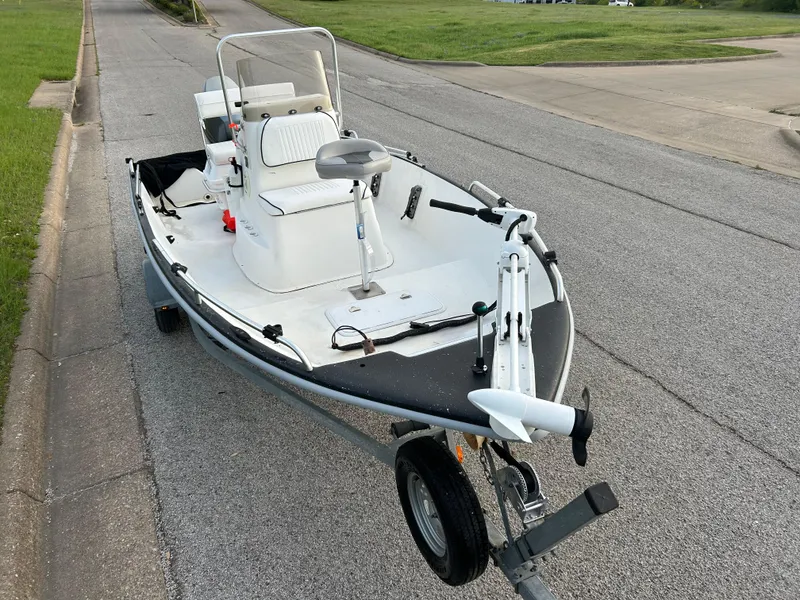 Slide: The Image of 2006 Carolina Skiff SEA CHASER boat on trailer, parked on a street. - 35