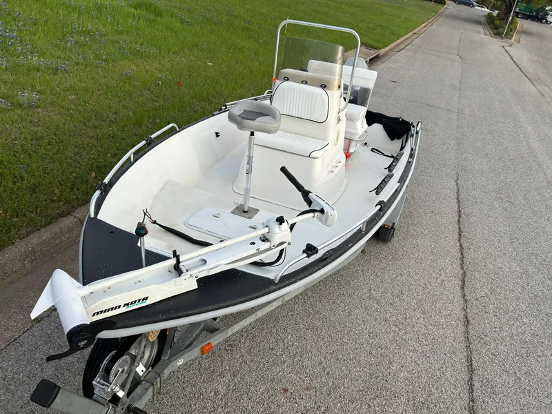 Slide: The Image of 2006 Carolina Skiff SEA CHASER boat on trailer, parked on roadside. - 36