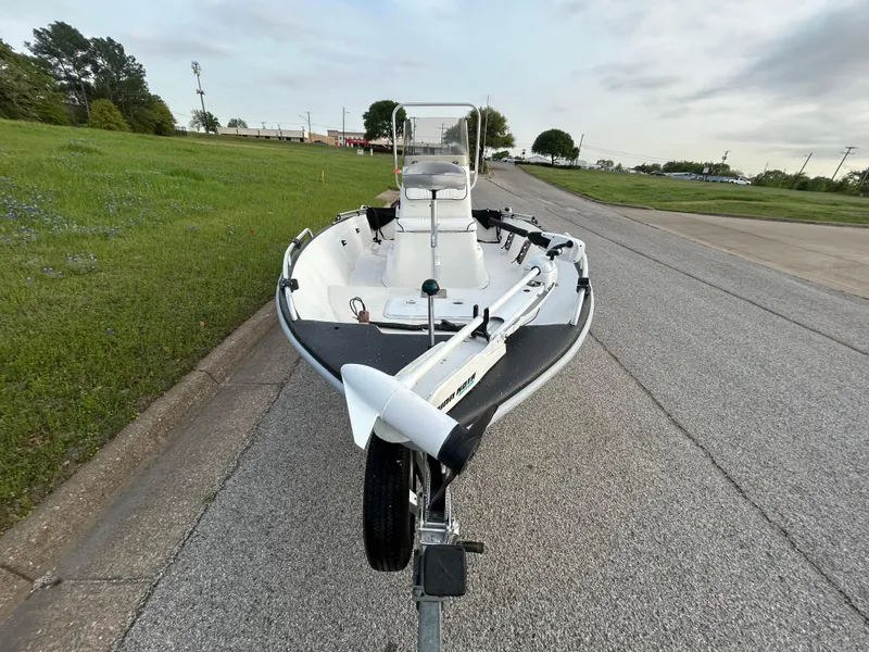 Slide: The Image of 2006 Carolina Skiff SEA CHASER boat on trailer, parked on roadside. - 37