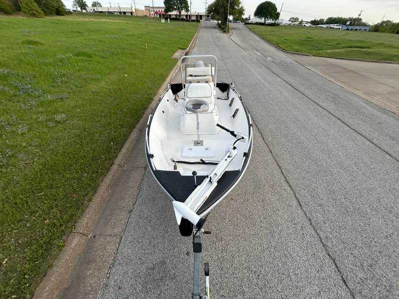 Slide: The Image of 2006 Carolina Skiff SEA CHASER boat on trailer, parked on roadside. - 39