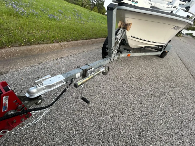 Slide: The Image of 2006 Carolina Skiff SEA CHASER boat on trailer, parked on roadside. - 40