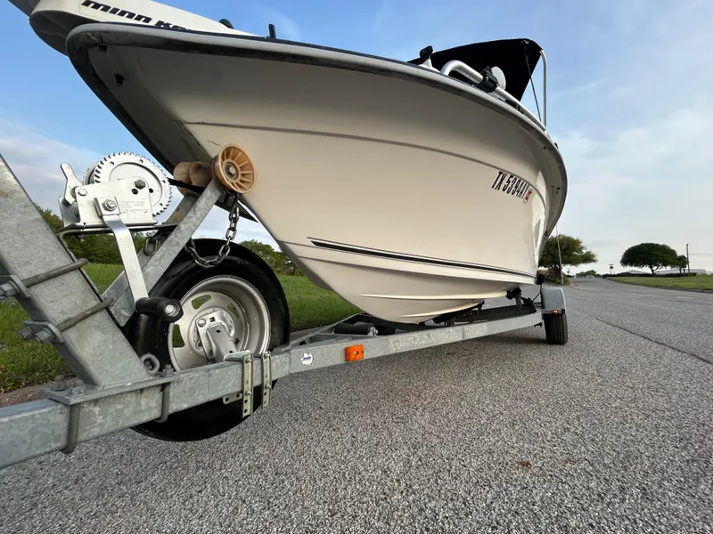 Slide: The Image of 2006 Carolina Skiff SEA CHASER boat on trailer, parked on a road. - 41