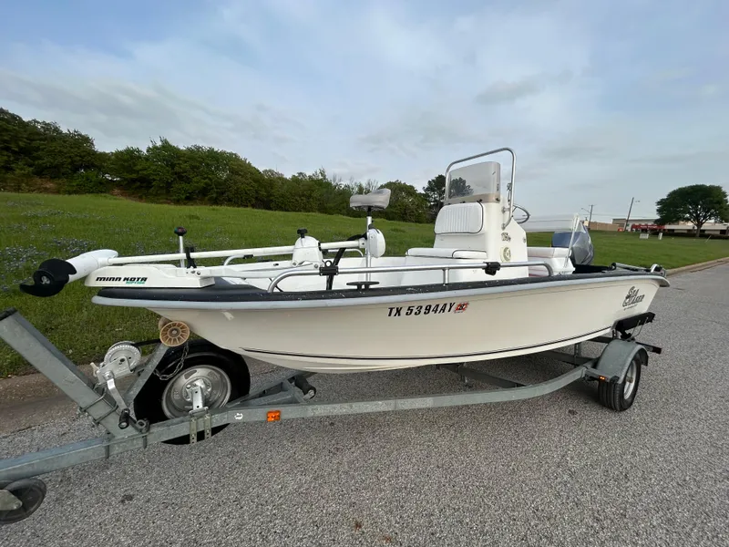 Slide: The Image of 2006 Carolina Skiff SEA CHASER boat on trailer, parked on roadside. - 42