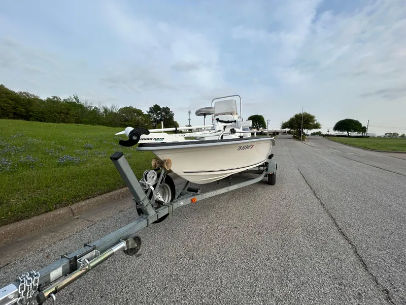 Slide: The Image of 2006 Carolina Skiff SEA CHASER boat on trailer, parked on roadside. - 43