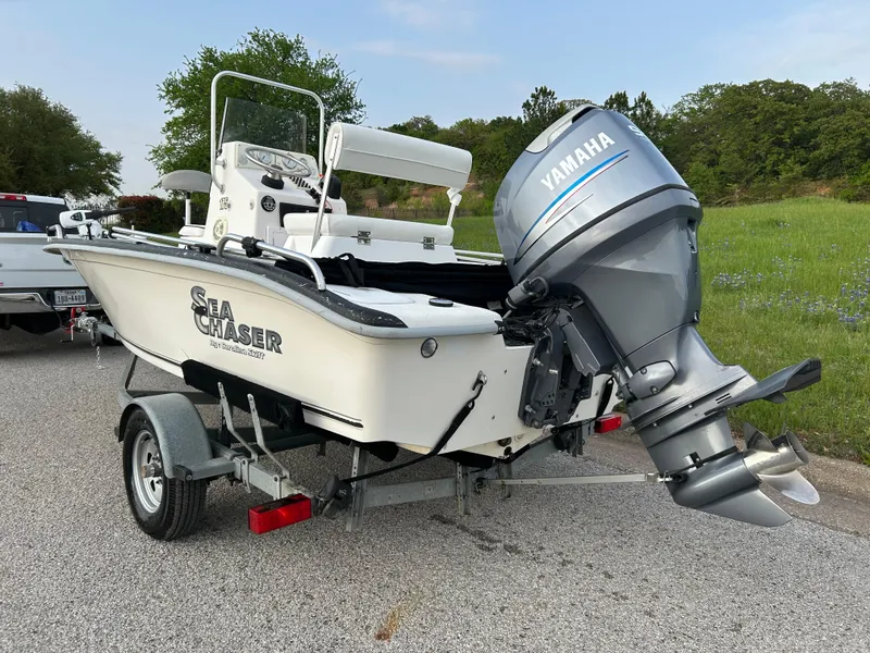 Slide: The Image of 2006 Carolina Skiff SEA CHASER boat with Yamaha outboard motor on trailer. - 46