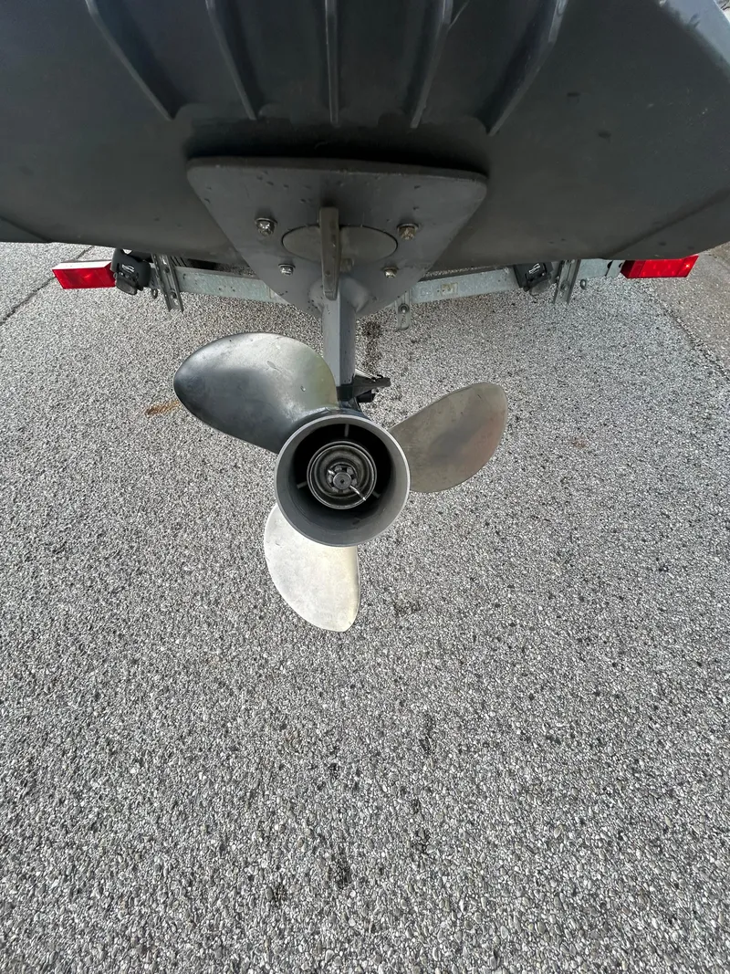 Slide: The Image of 2006 Carolina Skiff SEA CHASER boat propeller on asphalt background. - 49