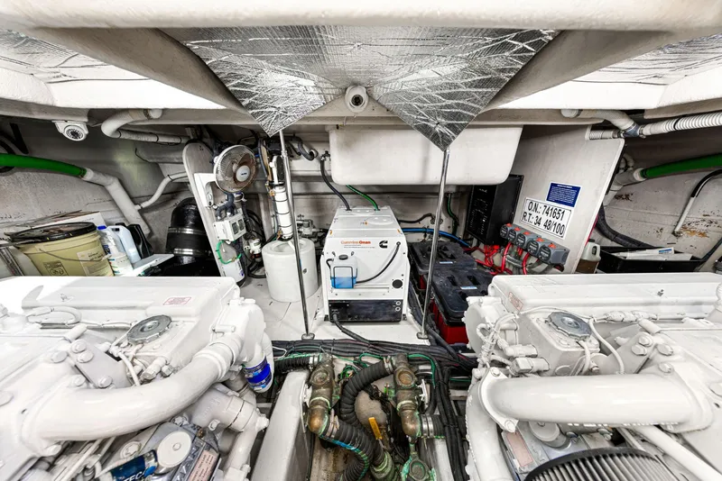 Slide: The Image of Engine room of 2009 Sea Ray 55 Sundancer yacht, showcasing machinery and equipment. - 28