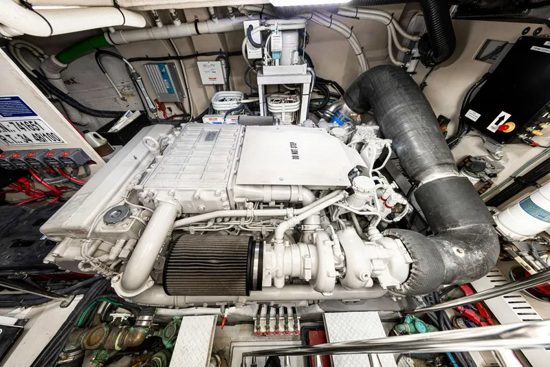 Slide: The Image of Engine room of a 2009 Sea Ray 55 Sundancer yacht, showcasing detailed machinery. - 30