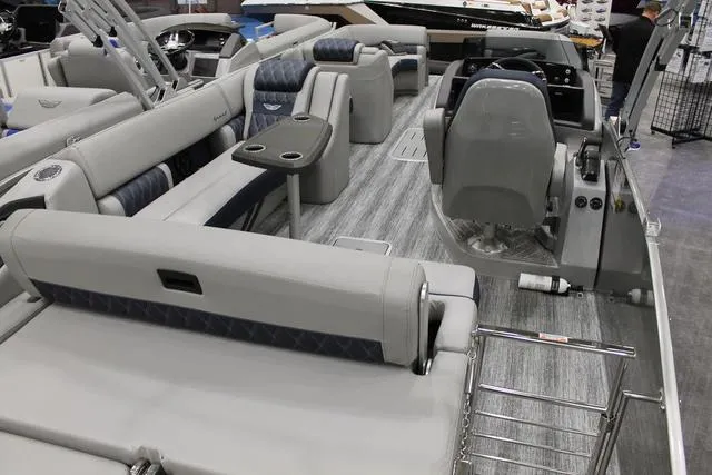 Slide: The Image of 2025 Bennington RX Sport Swingback 25 RXSB pontoon boat interior with luxurious seating and modern design. - 4