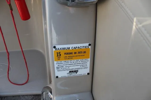 Slide: The Image of 2011 Harris 250 SL Grand Mariner capacity label, 15 persons or 2075 lbs limit. - 13