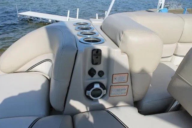 Slide: The Image of Luxury seating and controls on a 2011 Harris 250 SL Grand Mariner boat. - 18