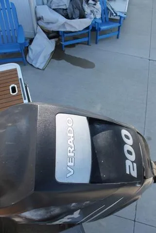 Slide: The Image of Outboard motor labeled "Verado 200" on a 2011 Harris 250 SL Grand Mariner. - 19