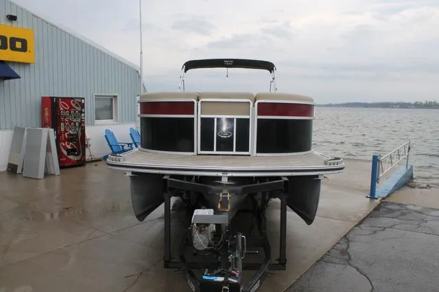 Slide: The Image of 2011 Harris 250 SL Grand Mariner pontoon boat on trailer by lakeside dock. - 2