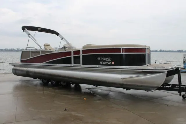 Slide: The Image of 2011 Harris 250 SL Grand Mariner pontoon boat on trailer by the water. - 3