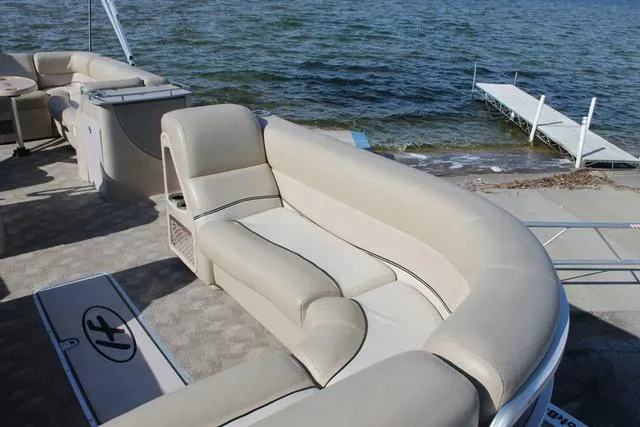 Slide: The Image of Luxurious seating on 2011 Harris 250 SL Grand Mariner pontoon boat by the water. - 7
