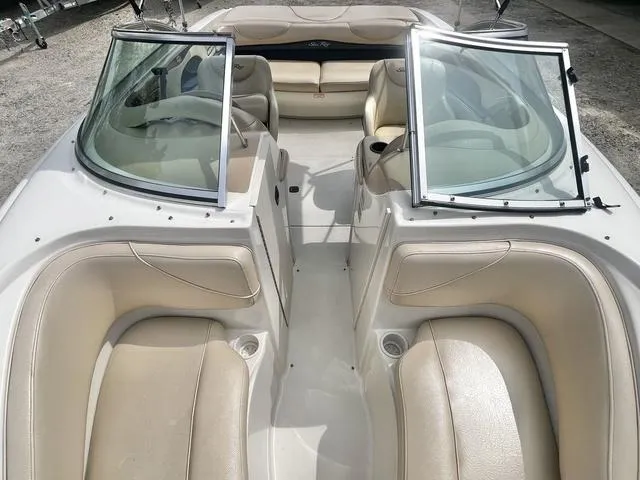 Slide: The Image of 2000 Sea Ray 210 Signature Bowrider with beige seating and open windshield. - 15