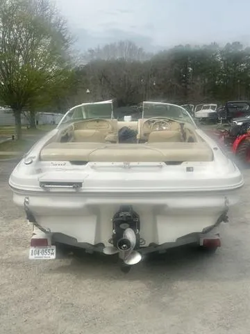 Slide: The Image of 2000 Sea Ray 210 Signature Bowrider boat, rear view, parked outdoors. - 4