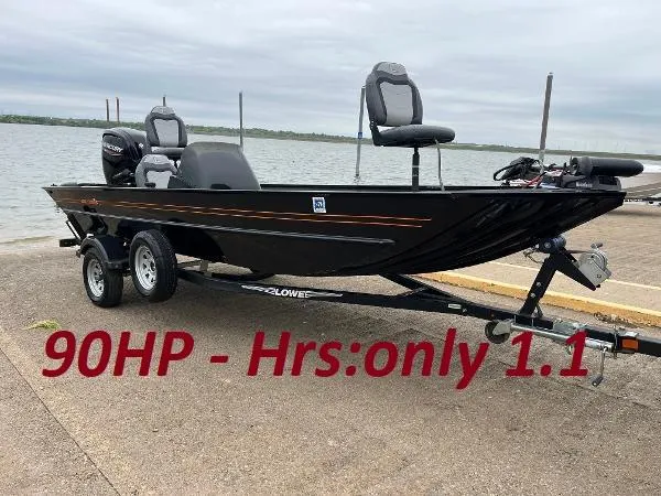 The Image of 2022 Lowe Legacy boat, 90HP engine, only 1.1 hours, parked by a lake. - 0