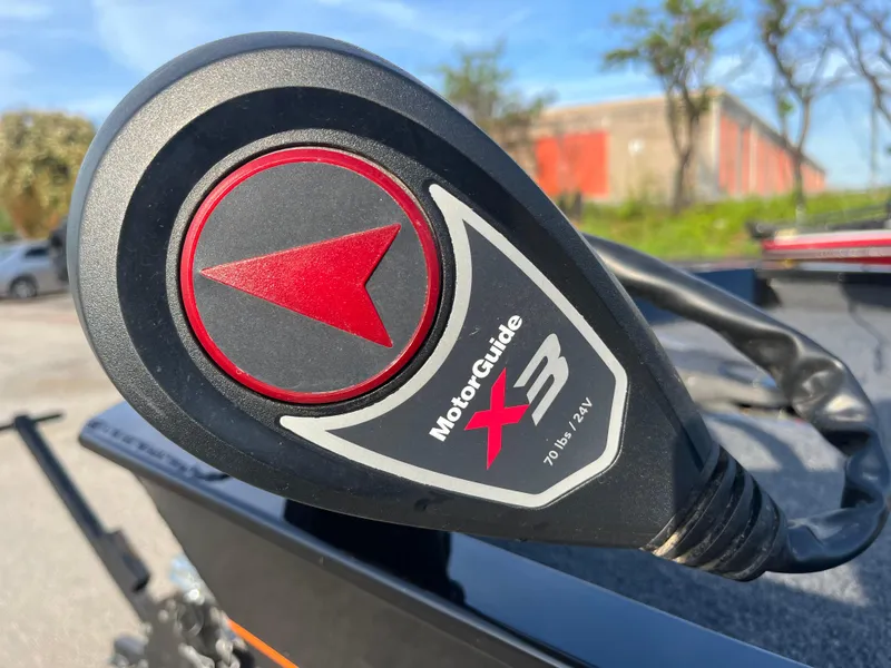 Slide: The Image of 2022 Lowe Legacy boat with Mercury engine on a trailer in a parking lot. - 11