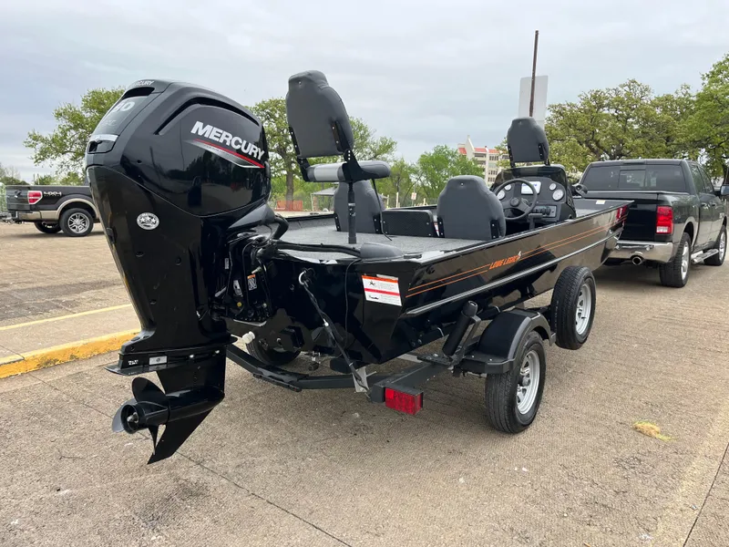 Slide: The Image of MotorGuide X3 trolling motor on a 2022 Lowe Legacy boat, close-up view. - 14