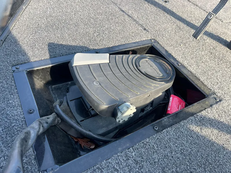 Slide: The Image of MotorGuide trolling motor on a 2022 Lowe Legacy boat, parked outdoors. - 25