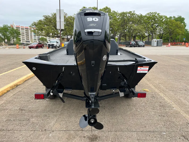 Slide: The Image of Boat propeller of a 2022 Lowe Legacy on a concrete surface. - 39