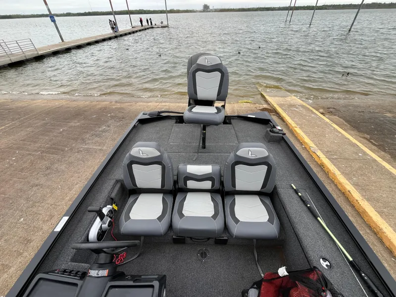 Slide: The Image of 2022 Lowe Legacy boat with Mercury engine on trailer in parking lot. - 9