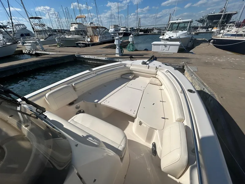Slide: The Image of 2020 Grady-White Fisherman 257 boat docked at marina with clear skies. - 2