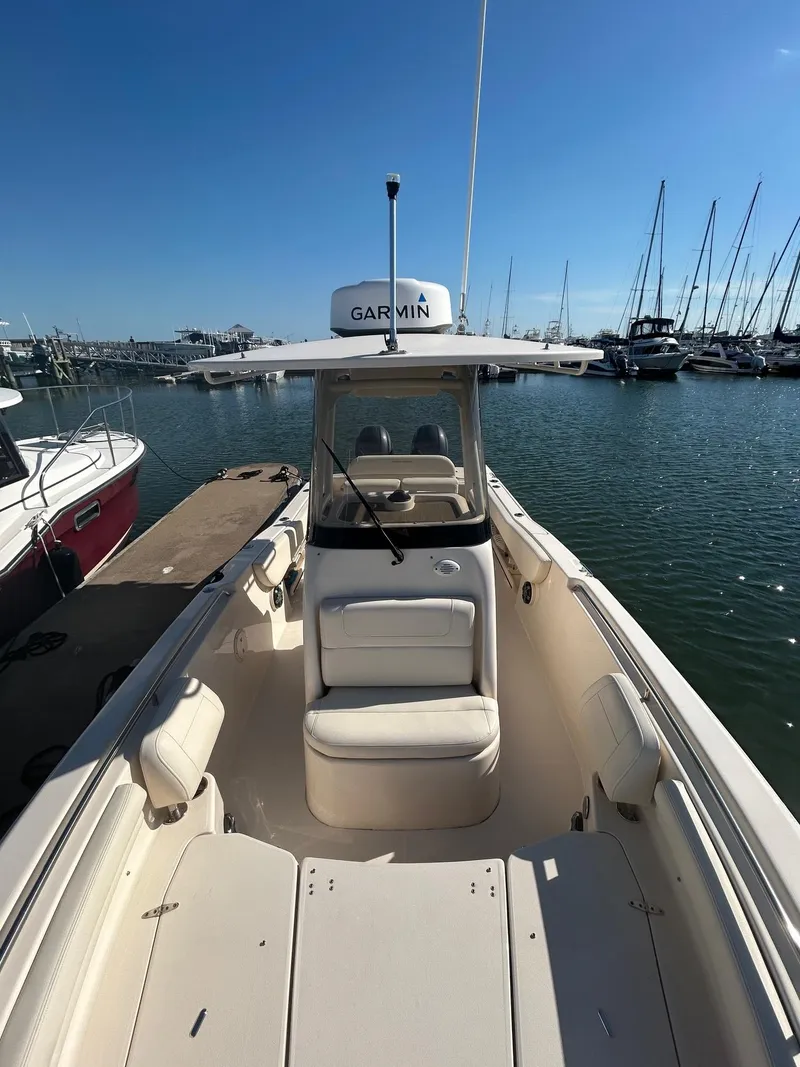 Slide: The Image of 2020 Grady-White Fisherman 257 boat docked in marina, clear sky, calm water. - 3