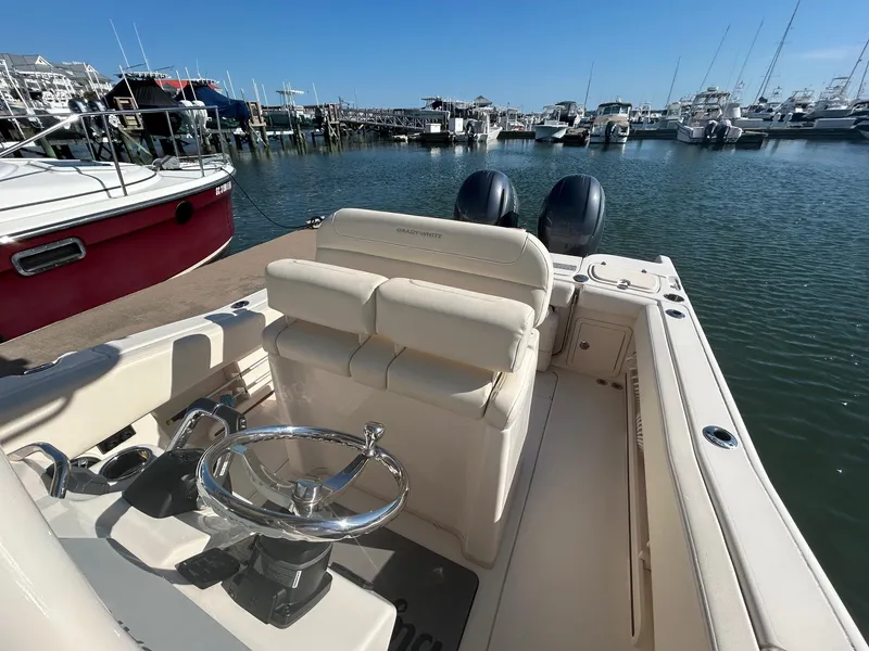 Slide: The Image of 2020 Grady-White Fisherman 257 boat docked in a marina with dual engines. - 7