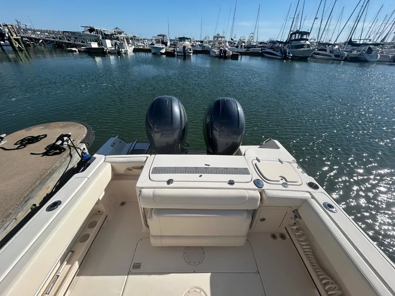 Slide: The Image of 2020 Grady-White Fisherman 257 boat docked in a marina with twin engines. - 9